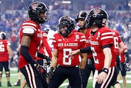 Texas Tech running back Cameron Dickey (8) celebrates his rushing touchdown with teammates...