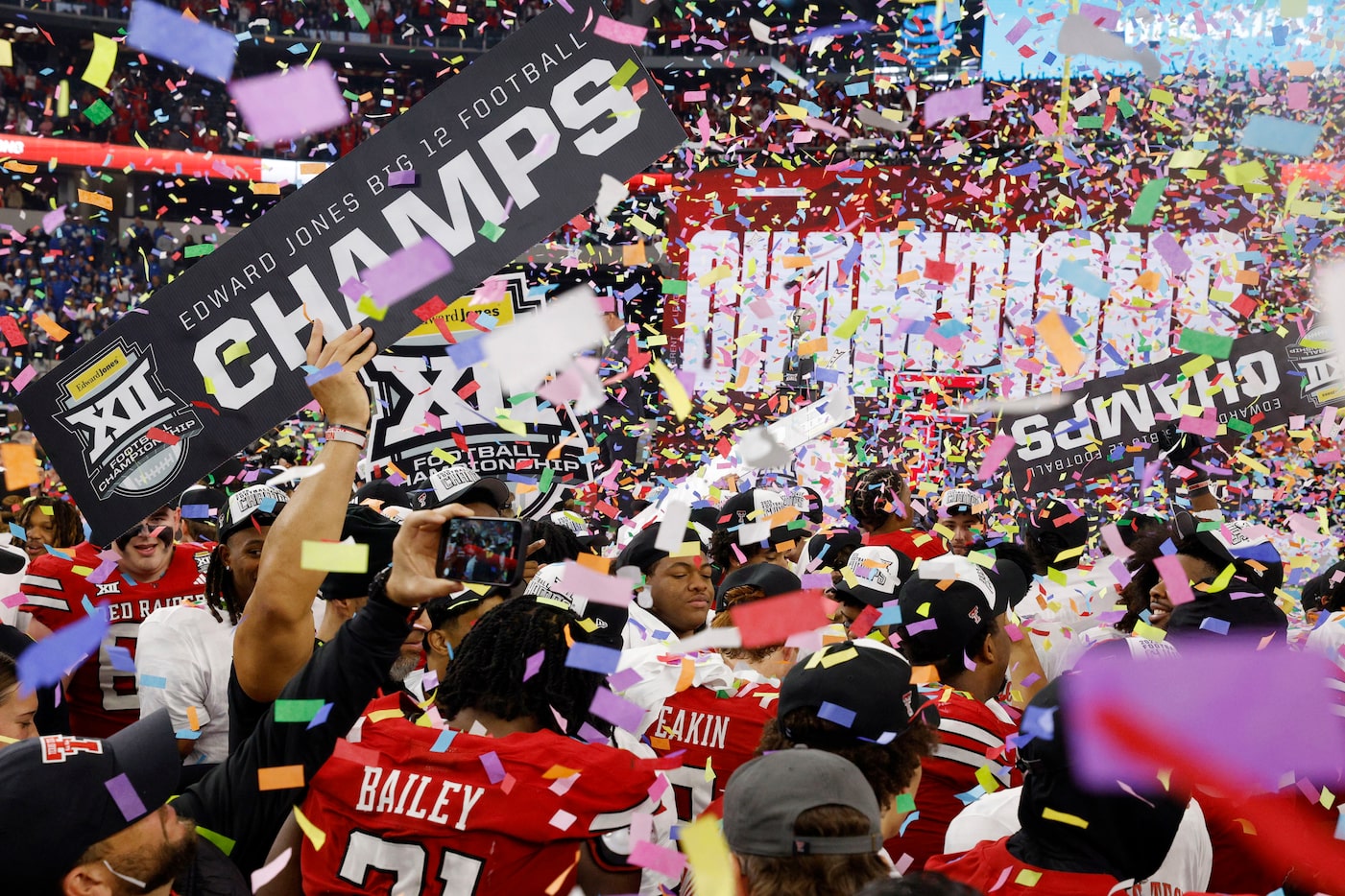 Texas Tech’s players celebrate after their victory against the BYU in the Big 12...