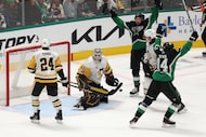 Pittsburgh Penguins goaltender Tristan Jarry (35) looks back after allowing a goal to Dallas...
