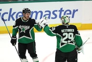 Dallas Stars right wing Mikko Rantanen (96) and goaltender Jake Oettinger (29) celebrate...