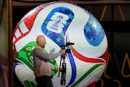 A member of the media works prior to the final draw for the 2026 FIFA World Cup at the...