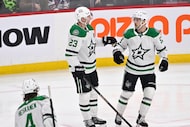 Dallas Stars' Esa Lindell (23) celebrates his goal on the Winnipeg Jets with Wyatt Johnston,...