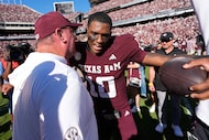 Texas A&M quarterback Marcel Reed (10) celebrates with head coach Mike Elko after an NCAA...