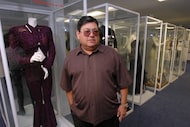 Abraham Quintanilla, father of the late singer Selena, poses in front of the outfits that...