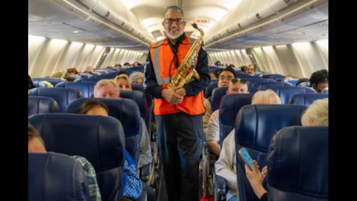 Holiday travel hits a sweeter note as Southwest Airlines worker plays sax at Houston airport