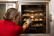 Carmen Romero prepares the birote bread for the tortas at Tortas Ahogadas Guadalajara in...