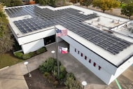Solar panels are seen on the roof of the West Dallas Branch Library on Sunday, Nov. 30,...