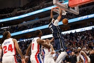 Dallas Mavericks forward Anthony Davis (3) dunks during overtime of an NBA basketball game...
