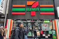 FILE - People shop at a 7-Eleven convenience store in New York, Tuesday, March 19, 2024. (AP...