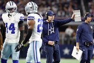 Dallas Cowboys defensive coordinator Matt Eberflus yells instruction to his players during...