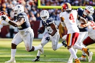 Dallas Cowboys running back Javonte Williams (33) finds a hole in the Washington Commanders...