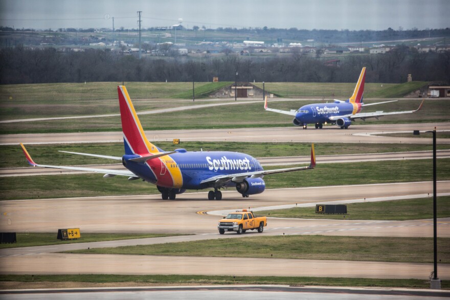Two Southwest Airlines planes navigate the taxiways at Austin-Bergstrom International Airport. 