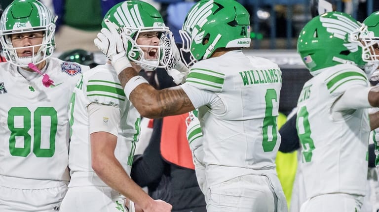 North Texas quarterback Drew Mestemaker, second from left, reacts with...