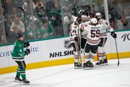 Dallas Stars defenseman Miro Heiskanen (4) skates by as Chicago Blackhawks center Jason...