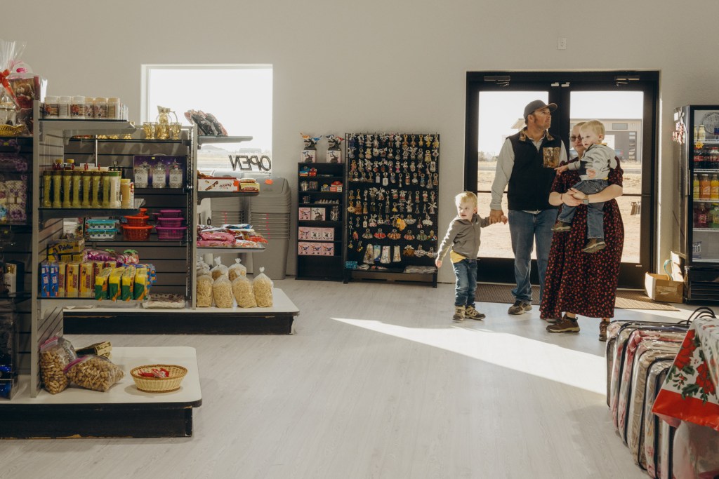 A Mennonite family enters Family Gift Shop on Nov. 29, 2025.
