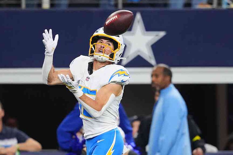 Los Angeles Chargers wide receiver Ladd McConkey (15) makes a touchdown catch during the first half of an NFL football game against the Dallas Cowboys, Sunday, Dec. 21, 2025, in Arlington, Texas. (AP Photo/Julio Cortez)