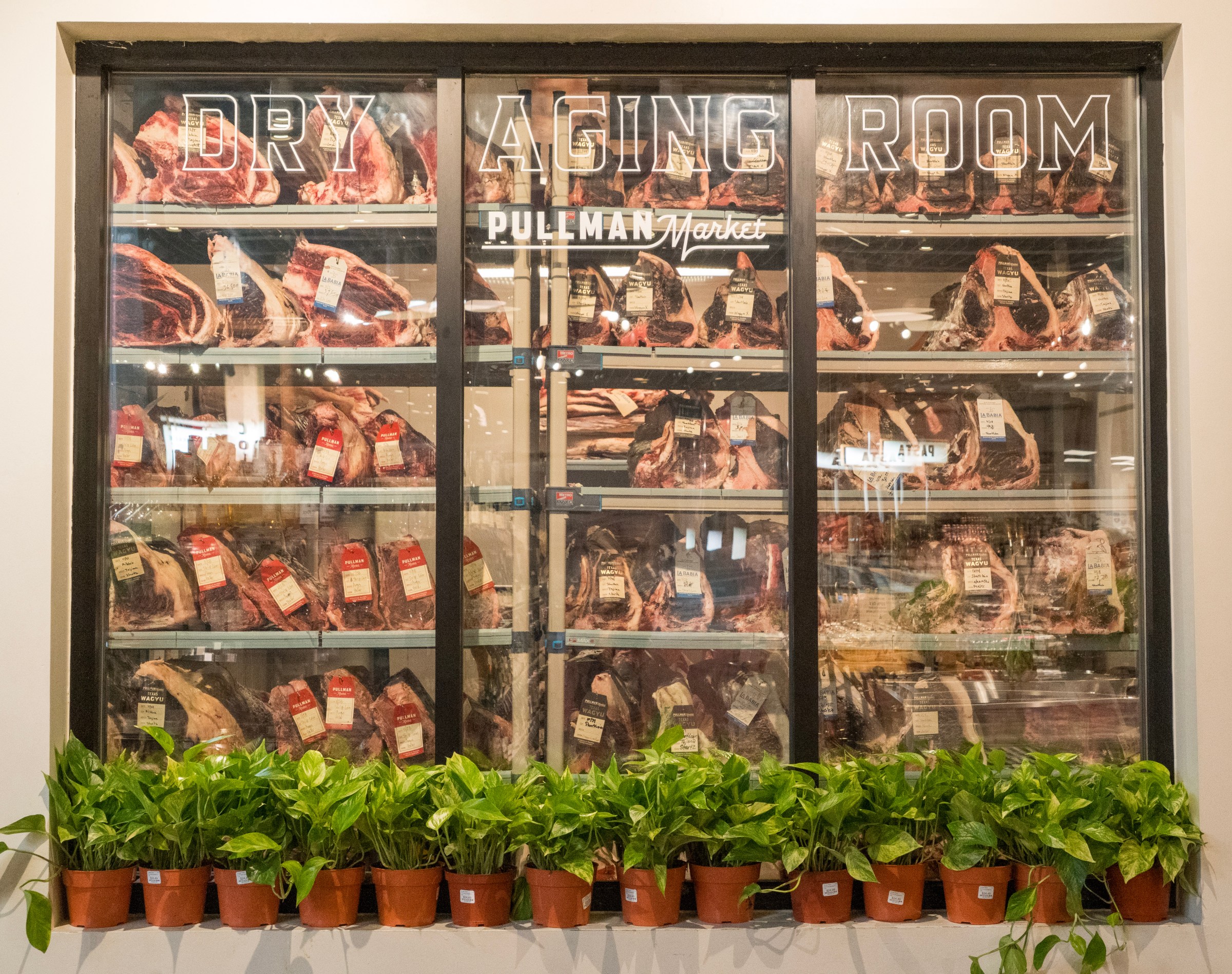 A fridge full of dry aged beef.