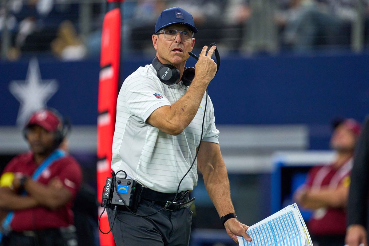 Los Angeles Chargers head coach Jim Harbaugh looks on during an NFL football game against the Dallas Cowboys, on Sunday December 21, 2025 in Arlington, Texas. Los Angeles Chargers head coach Jim Harbaugh looks on during an NFL football game against the Dallas Cowboys, on Sunday December 21, 2025 in Arlington, Texas.