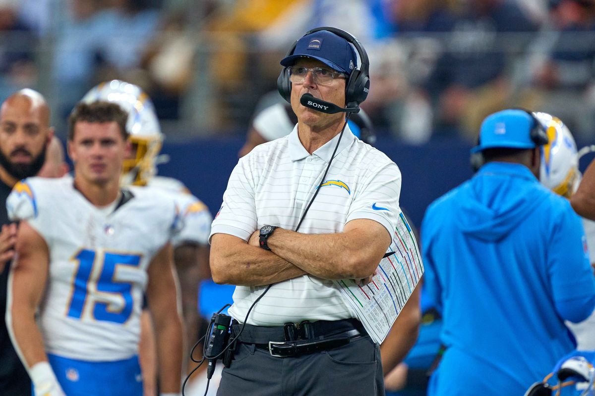 Los Angeles Chargers head coach Jim Harbaugh looks on during an NFL football game against the Dallas Cowboys, on Sunday December 21, 2025 in Arlington, Texas. Los Angeles Chargers head coach Jim Harbaugh looks on during an NFL football game against the Dallas Cowboys, on Sunday December 21, 2025 in Arlington, Texas.
