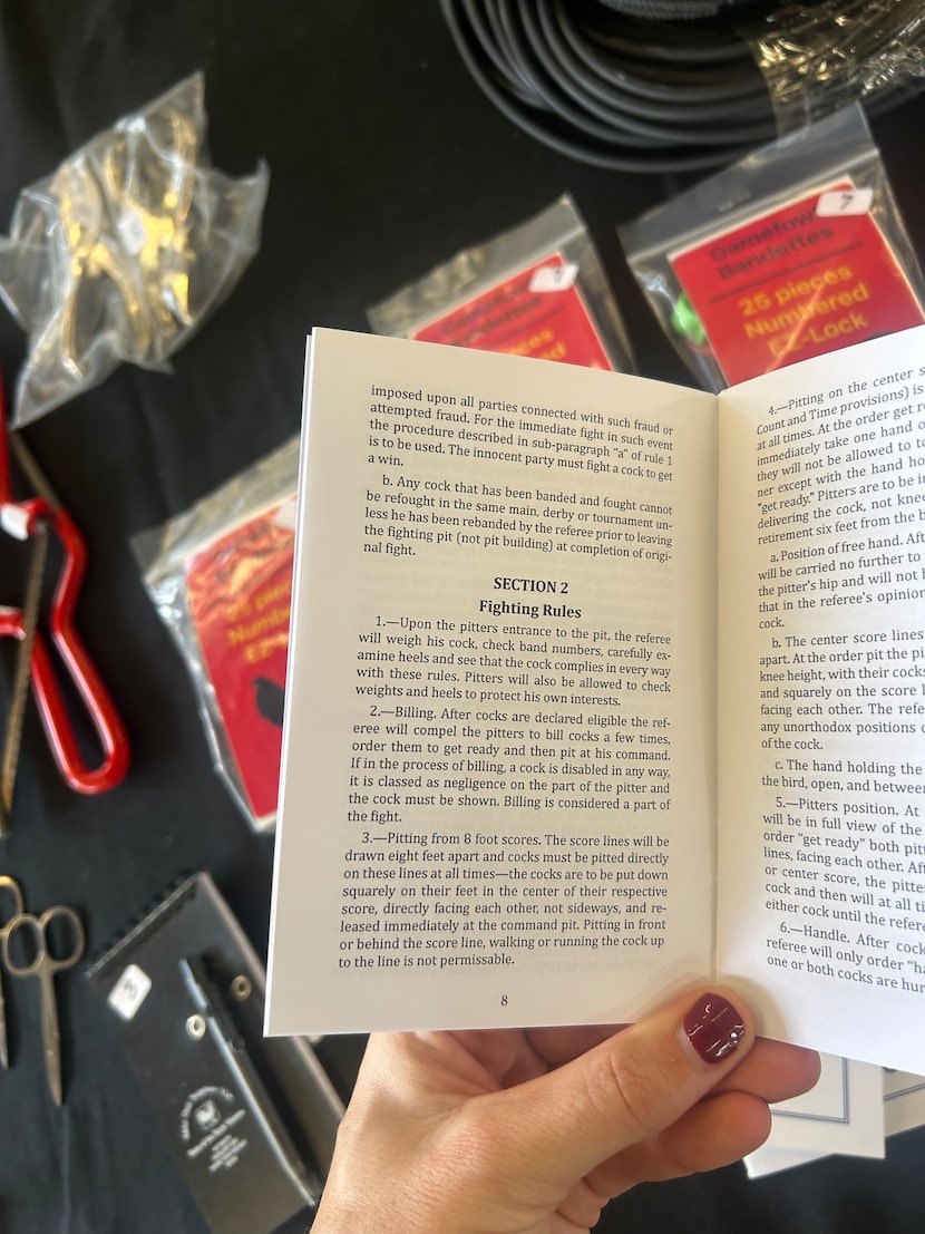 A cockfighting rule book for sale at El Gallo Show Worldwide on Nov. 22, 2025. Vendor David...