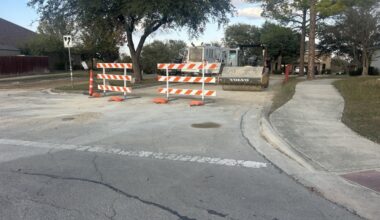 A street in Schertz, texas is seen under construction on a sunny day.