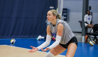 Dallas Pulse volleyball player Isabel Martin crouches with her hands in front of her