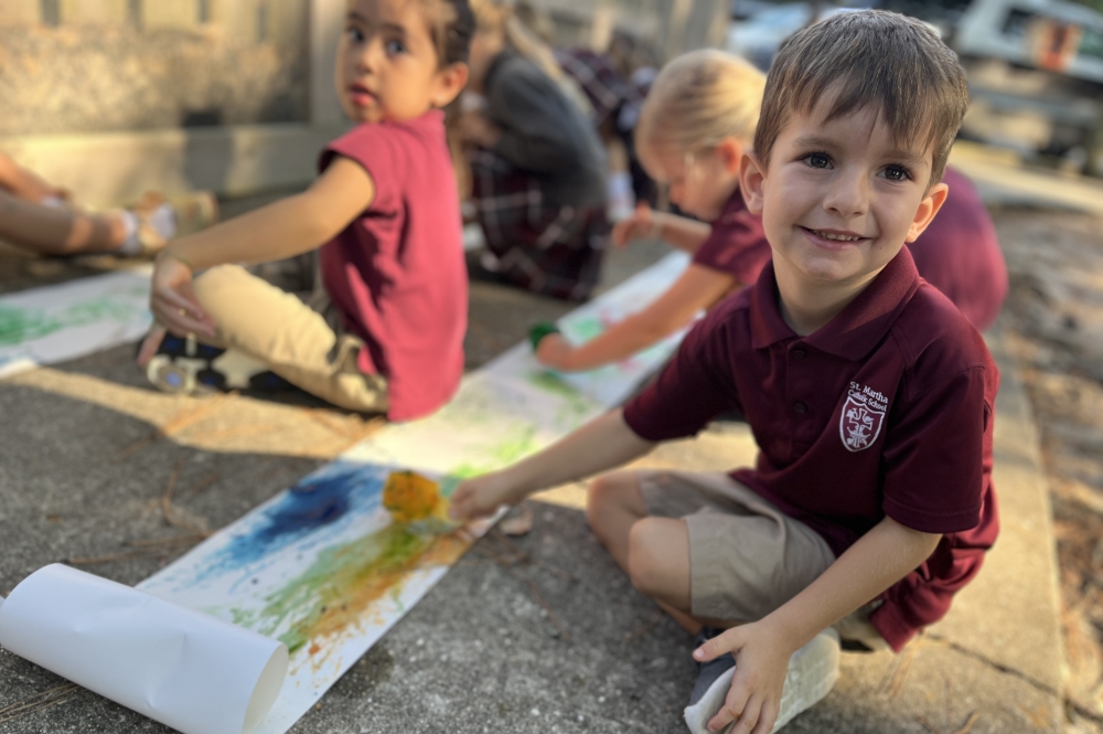 kids color on a sidewalk