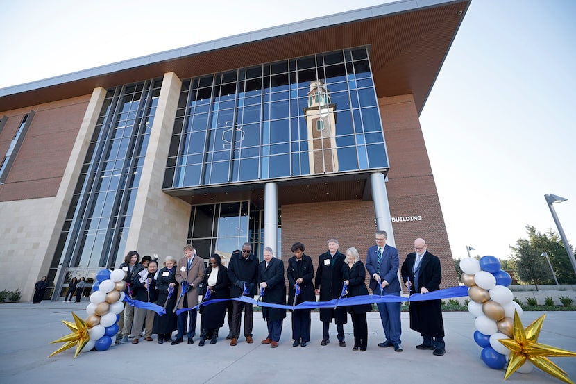 Warren von Eschenbach (center), president of the University of North Texas at Dallas, and...