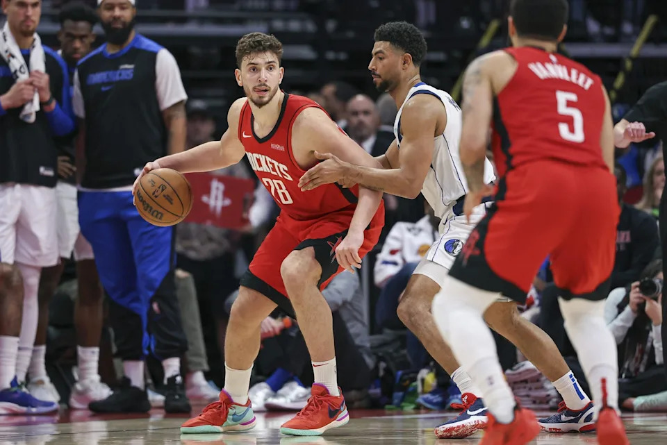 Jan 1, 2025; Houston, Texas, USA; Houston Rockets center Alperen Sengun (28) controls the ball during the fourth quarter against the Dallas Mavericks at Toyota Center. Mandatory Credit: Troy Taormina-Imagn Images