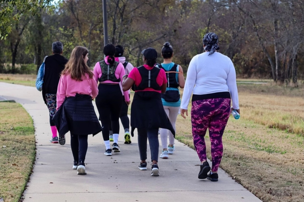 A group of women walking in a park