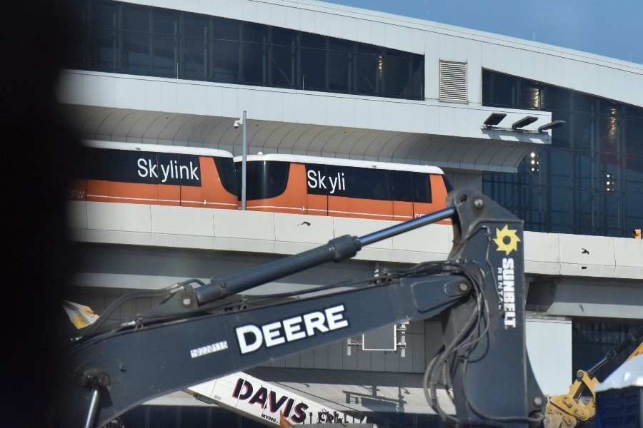 A Skylink train drives over a construction area near Terminal C at Dallas Fort Worth International Airport. (Cody Thorn/Community Impact)