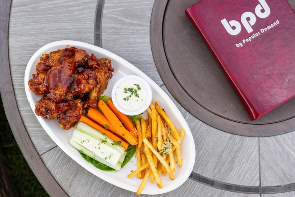 By Popular Demand was designed as a gathering place where friends and neighbors can relax. (Courtesy By Popular Demand)