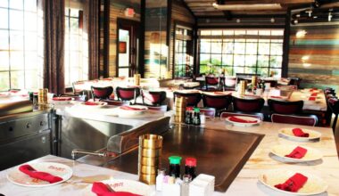 Tables set up for a hibachi experience in a restaurant.