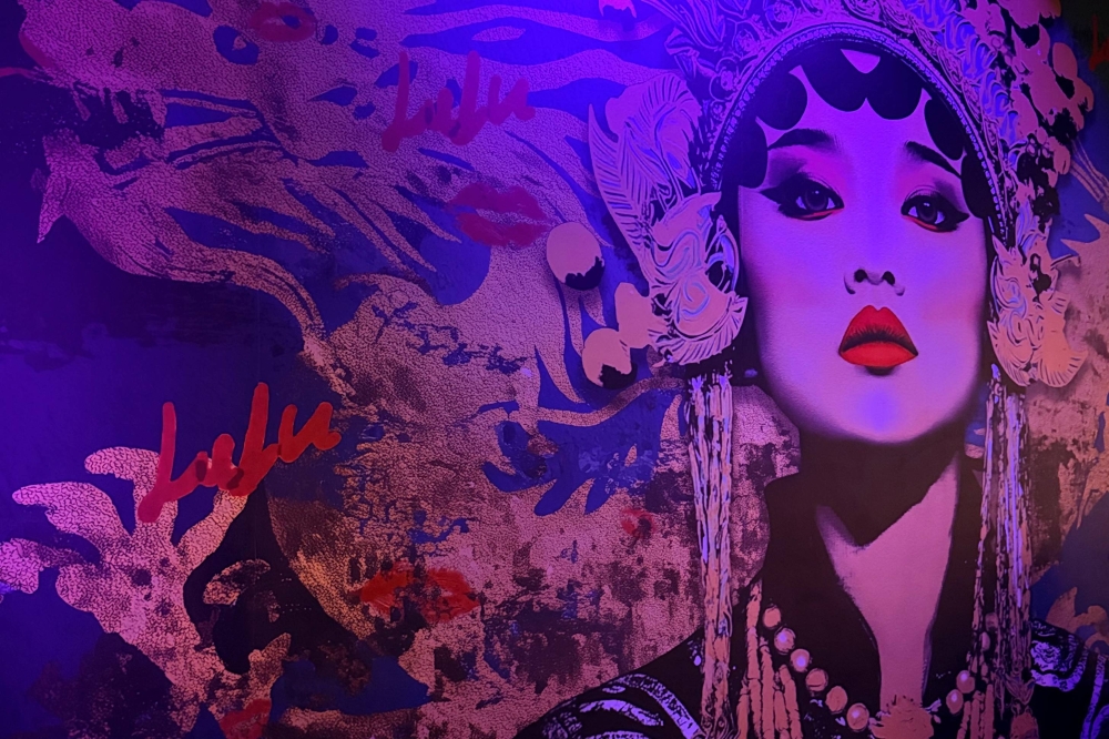 Cool-toned mural of an Asian female.