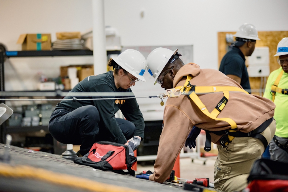 people working with white hard hats on