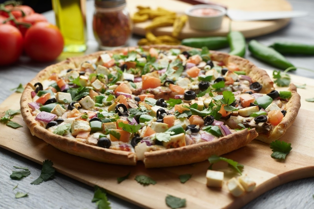 Pizza Twist serves traditional pizzas, Indian-fusion pizzas, pastas and more, with Halal and gluten-free options available. (Courtesy Pizza Twist)