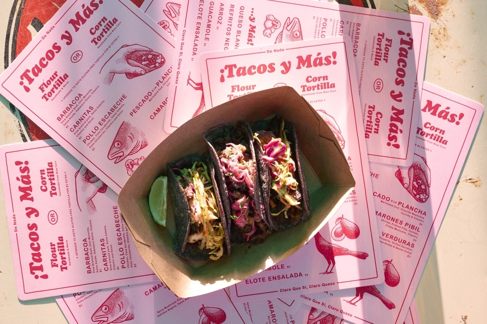 Three tacos served on top of De Nada menus