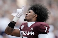 Texas A&M wide receiver KC Concepcion (7) gestuers after praying before the start of an NCAA...