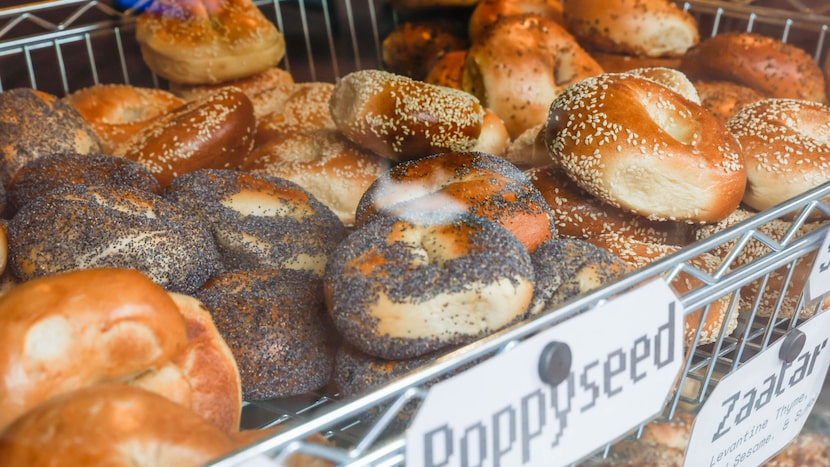 At Starship Bagel's downtown Dallas shop, customers buy breakfast from a stand near "The...