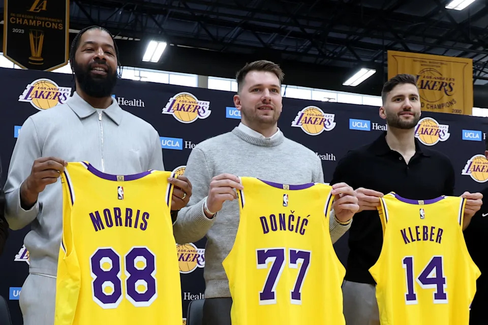 EL SEGUNDO, CALIFORNIA - FEBRUARY 04: (L-R) Markieff Morris, Luka Doncic and Maxi Kleber of the Los Angeles Lakers hold their new jerseys during a press conference at UCLA Health Training Center on February 04, 2025 in El Segundo, California. (Photo by Harry How/Getty Images)