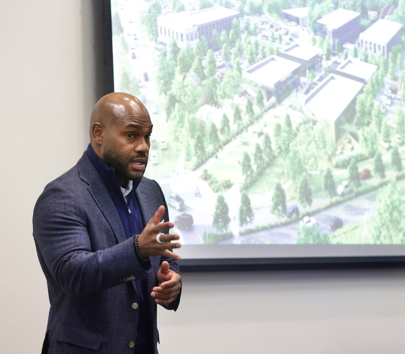 Terrence Maiden speaks about a nearby 90-acre development during Russell Glen Company's...