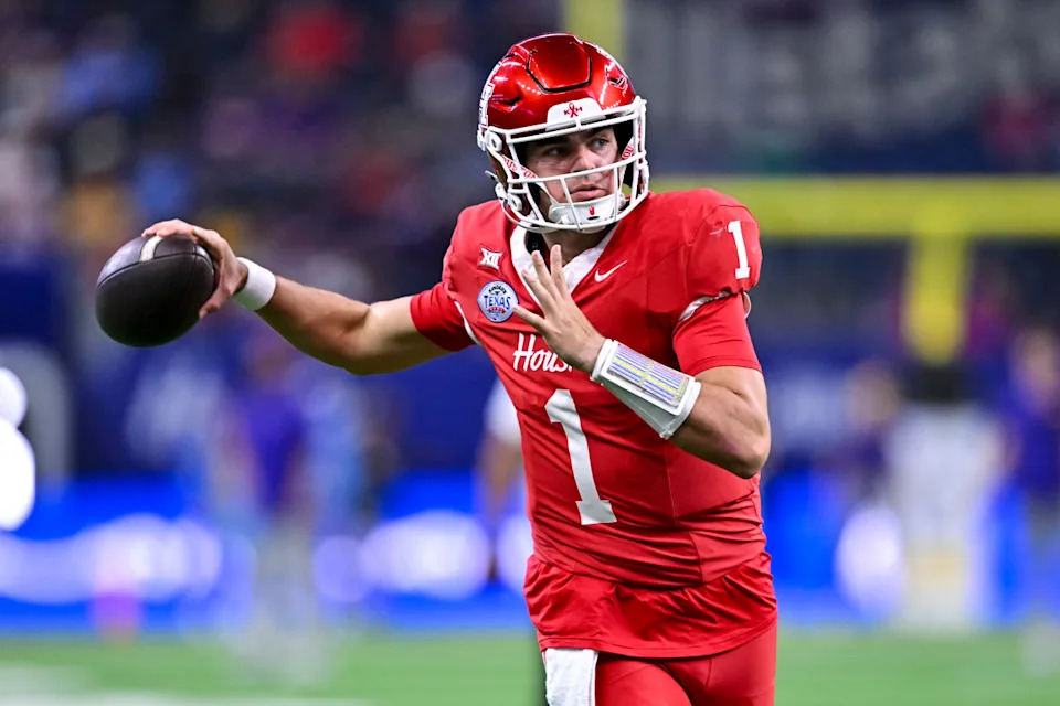Dec 27, 2025; Houston, TX, USA; Houston Cougars quarterback Conner Weigman (1) warms up prior to the game against the Louisiana State Tigers at NRG Stadium.© Maria Lysaker-Imagn Images