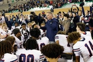 Allen's head coach Lee Wiginton speaks his players after their 33-21 victory against North...