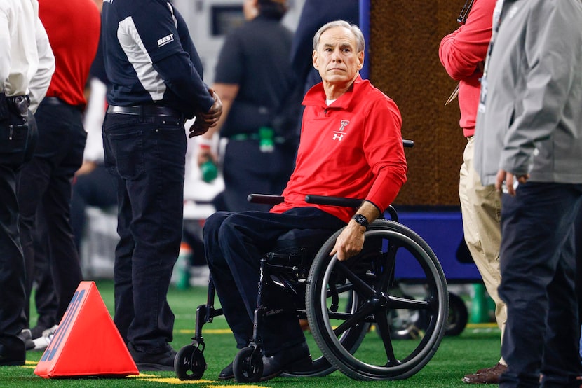 Gov. Greg Abbott watches the first half of the Big 12 Championship football game between...