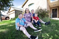 The Owens family — (from left) Micah, Abigail, Samuel and Oren — pose at their home in...