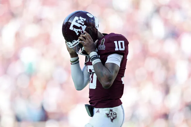 COLLEGE STATION, TEXAS - DECEMBER 20: Malachi Toney #10 of the Miami Hurricanes reacts after throwing an interception in the fourth quarter against the Miami Hurricanes during the 2025 College Football Playoff First Round Game at Kyle Field on December 20, 2025 in College Station, Texas. (Photo by Tim Warner/Getty Images)