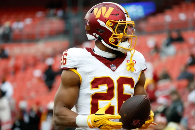 Dec 25, 2025; Landover, Maryland, USA; Washington Commanders running back Jeremy McNichols (26) looks on during warmups before the game against the Dallas Cowboys at Northwest Stadium. Mandatory Credit: Amber Searls-Imagn Images