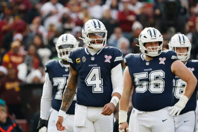 Dec 25, 2025; Landover, Maryland, USA; Dallas Cowboys quarterback Dak Prescott (4) looks on during a stoppage in play against the Washington Commanders during the first half at Northwest Stadium. Mandatory Credit: Amber Searls-Imagn Images
