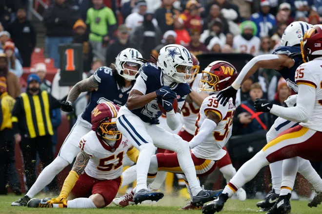 Dec 25, 2025; Landover, Maryland, USA; Dallas Cowboys wide receiver Kavontae Turpin (9) carries the ball against the Washington Commanders during the first half at Northwest Stadium. Mandatory Credit: Amber Searls-Imagn Images