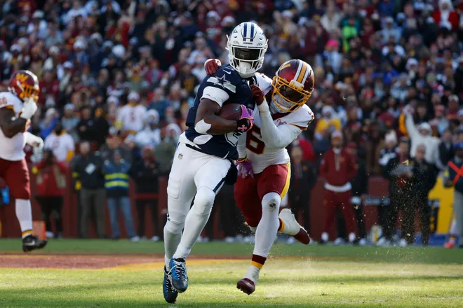 Dec 25, 2025; Landover, Maryland, USA; Dallas Cowboys wide receiver George Pickens (3) carries the ball as Washington Commanders cornerback Noah Igbinoghene (6) defends during the first half at Northwest Stadium. Mandatory Credit: Amber Searls-Imagn Images